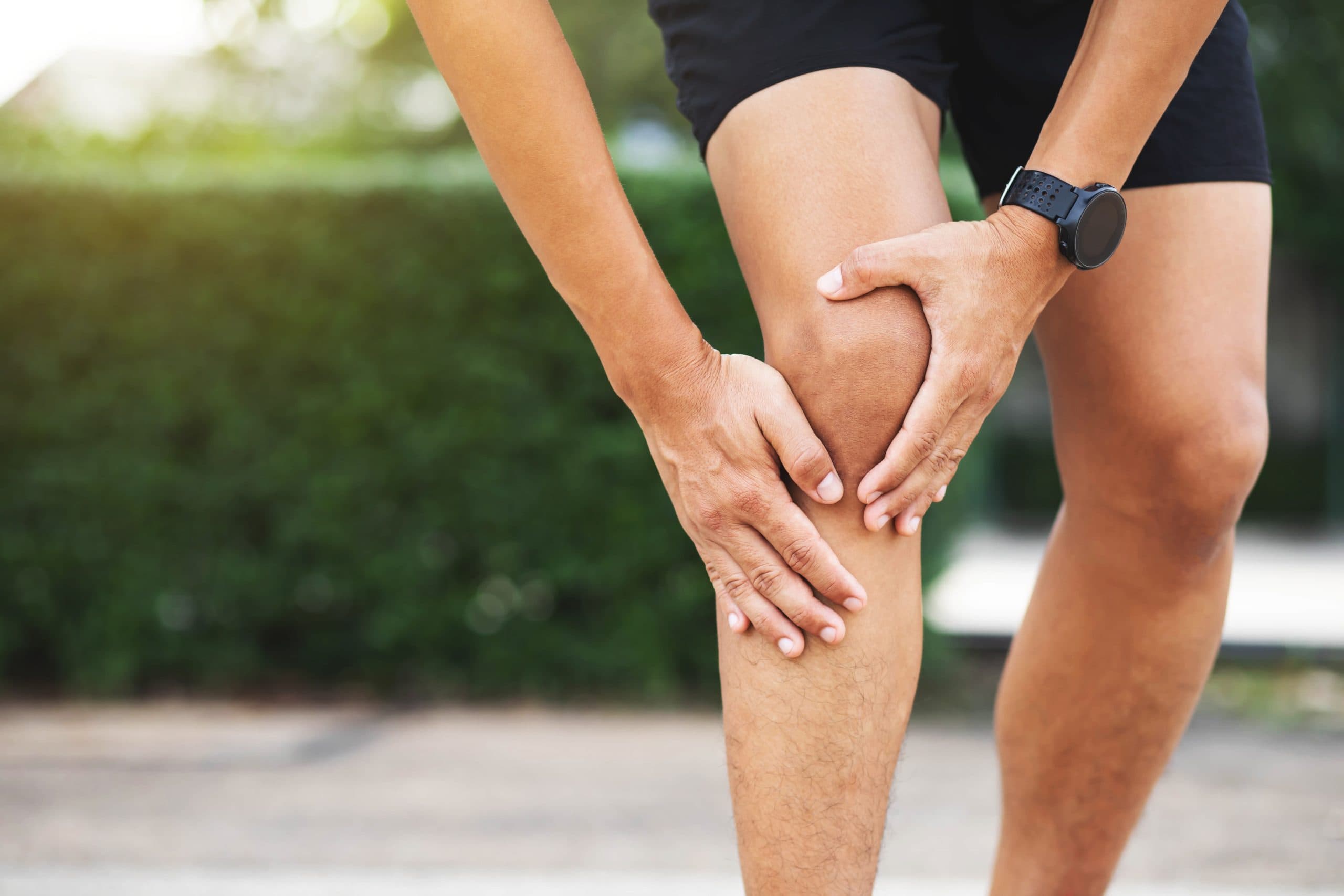 Close-up of sports-related knee pain outdoors